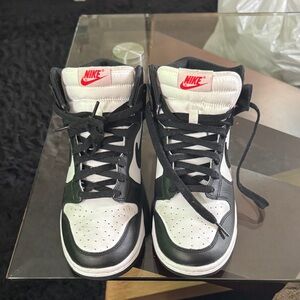Nike Black and White High-Top Sneakers with Red Logo